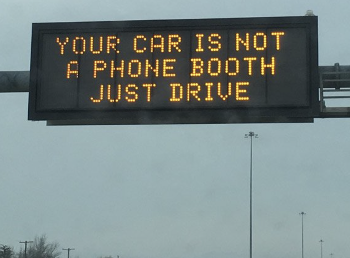 electronic sign hacks - sarcastic - Your Car Is Not A Phone Booth Just Drive