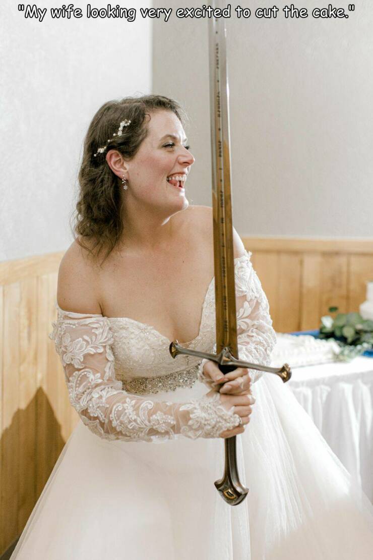 bride - "My wife looking very excited to cut the cake."
