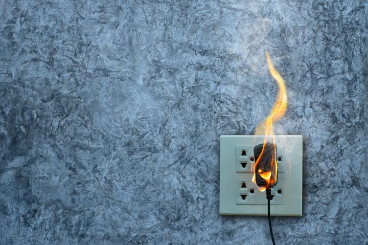 life hacks and tips - electrical plug on fire background