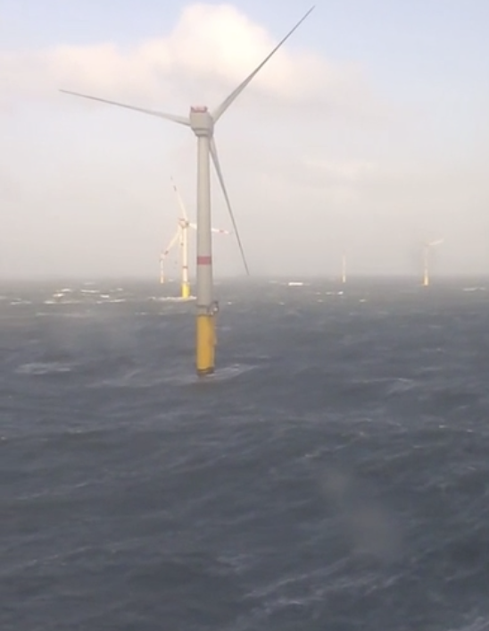 Just some wind turbines out in the middle of the ocean.