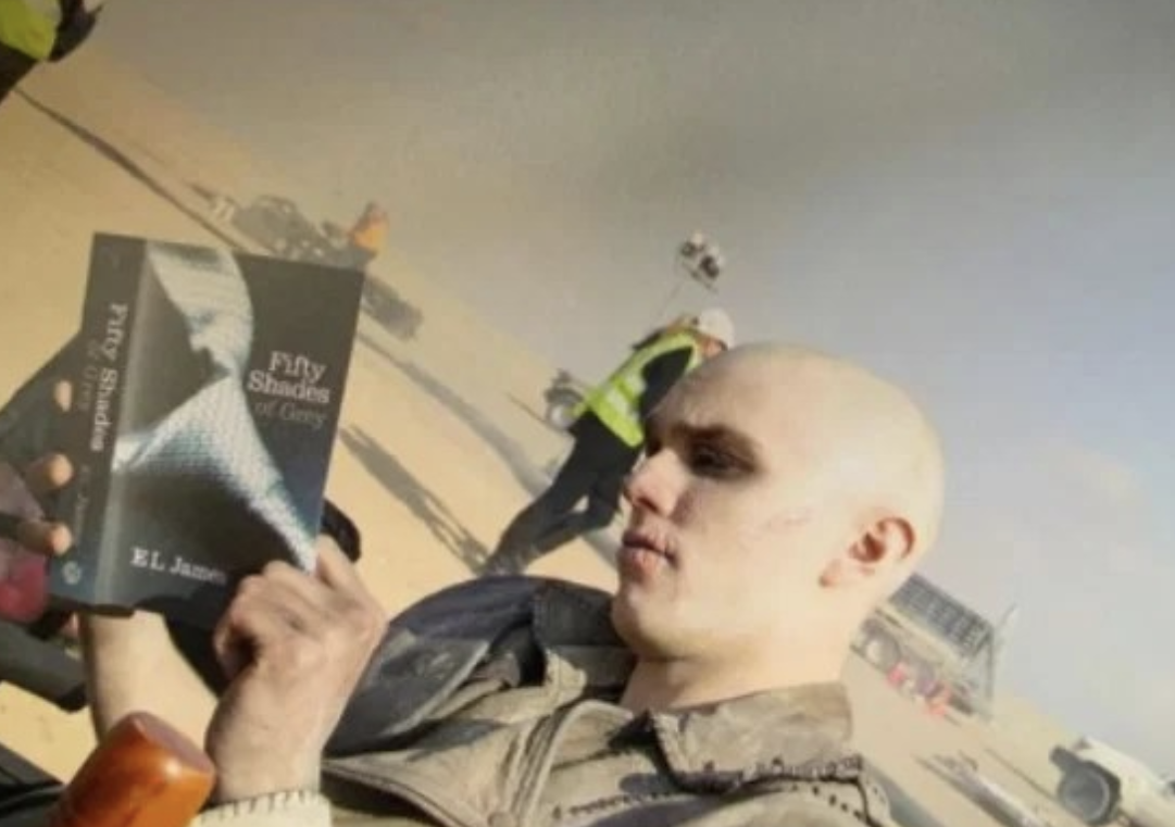 Nicholas Hoult getting in some light reading in between takes of 'Mad Max: Fury Road.'