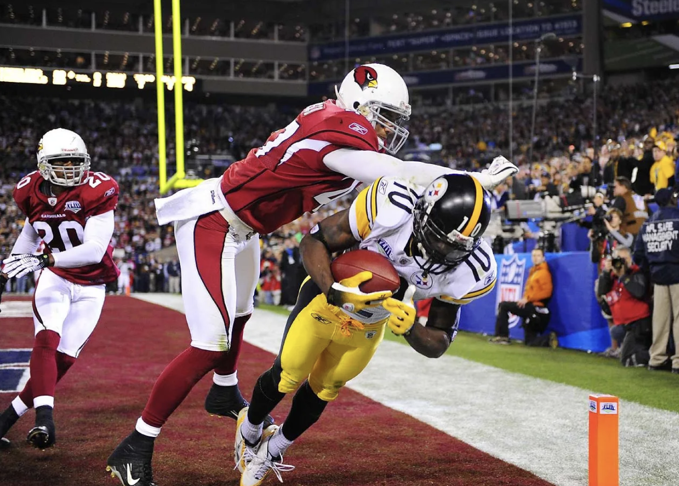 Super Bowl XLIII, 2009. Santonio Holmes catching the game-winning touchdown pass. Photo by: Al Tielemans.