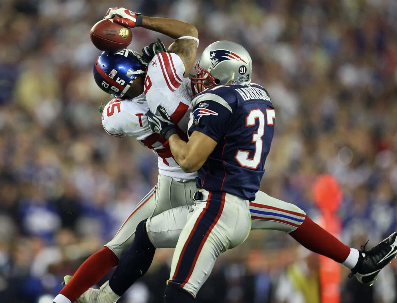 David Tyree 'helmet catch' against Rodney Harrison. Super Bowl XLII 2008. Giants beat Patriots 17-14. Photo by: Damian Strohmeyer.