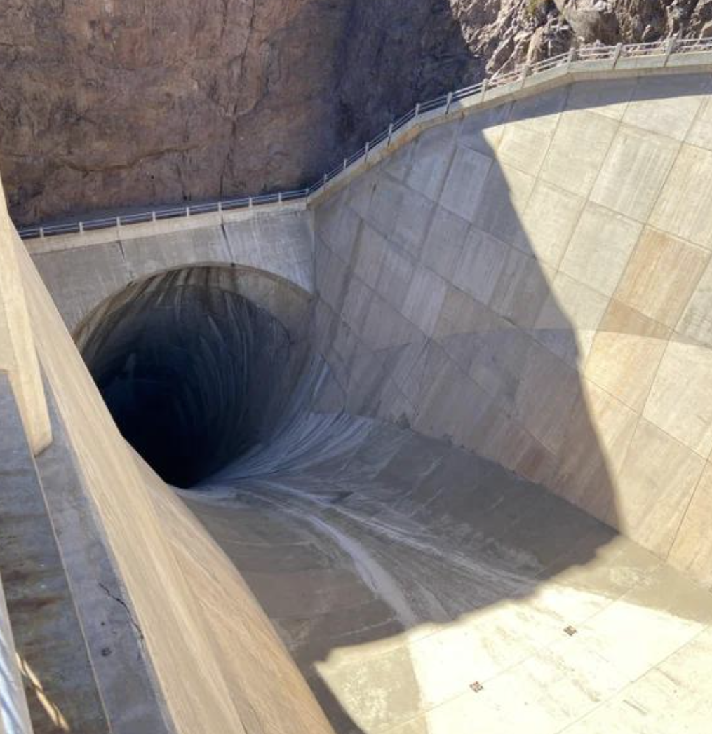 A hoover dam spillway, that looks like a waterslide to the underworld.