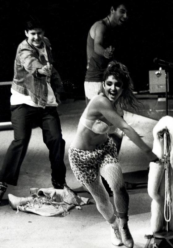 1985, The Beastie Boys have some fun with Madonna, chasing the pop star around the stage with squirt guns.