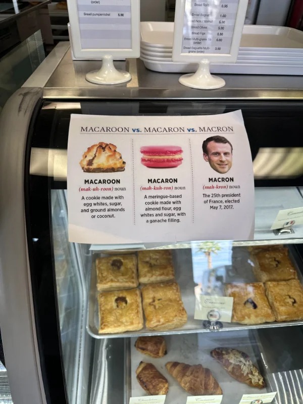 “This French bakery has a sign describing the difference between Macaroons, Macarons, and Macron.”