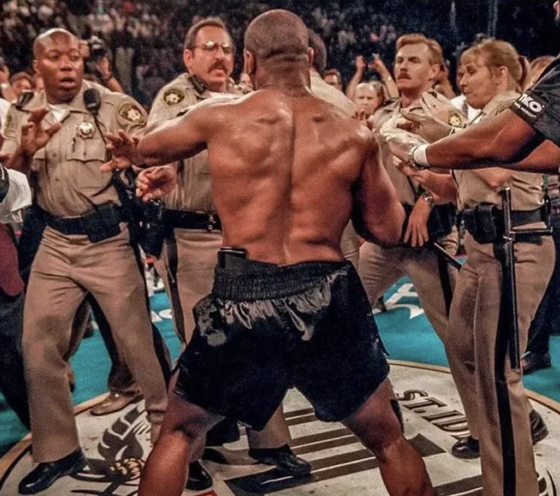 Tyson fighting Las Vegas police after biting Holyfield's ear.