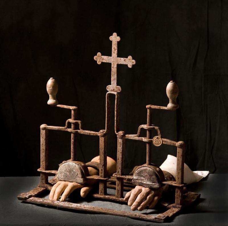 creepy and captivating photos - catholic hand crushing machine - 235 Sandr