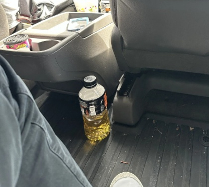 My uber driver has what appears to be a mobile toilet near my feet.