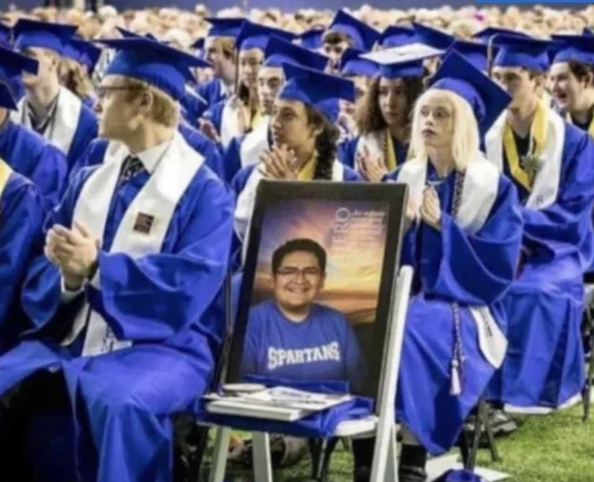 Kendrick Castillo who died in a school shooting, graduates with his classmates.