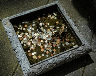 Dive into the wishing well to collect quarters to use for the vending machine. It's one of those surreal memories that's stuck with me. -Alveryn