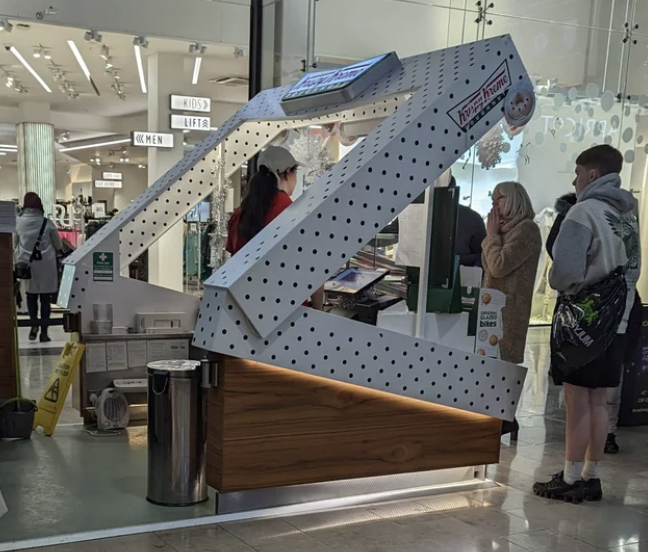 This Krispy Kreme restaurant shaped like a box.
