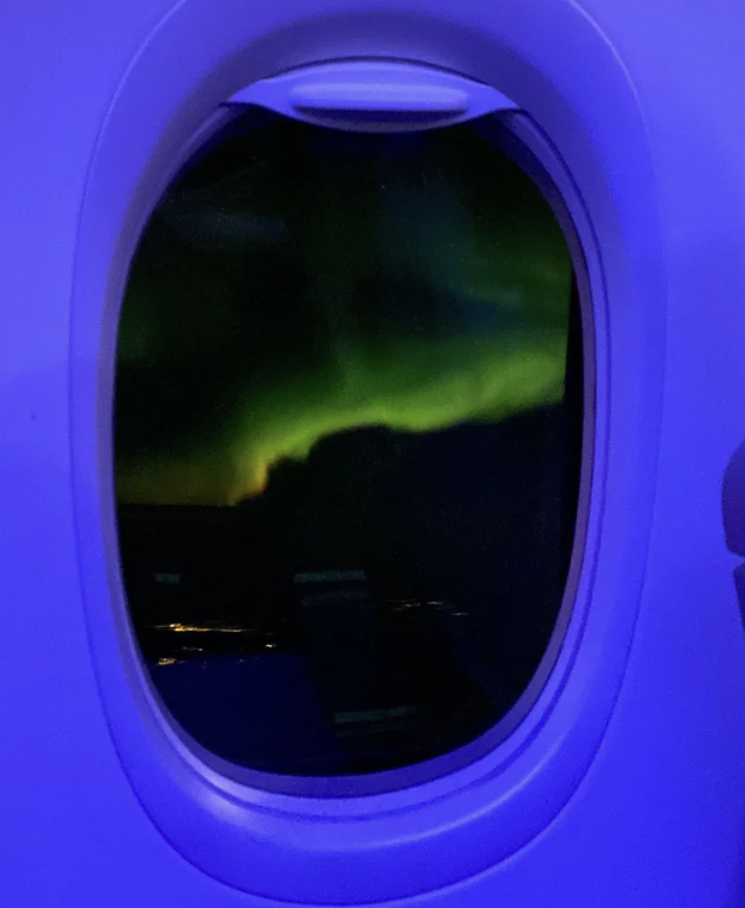 Northern lights from inside of a plane.