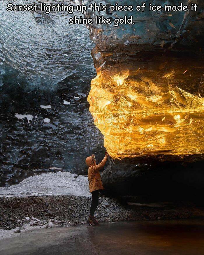 funy filled photos - amber ice cave - Sunset lighting up this piece of ice made it shine gold.