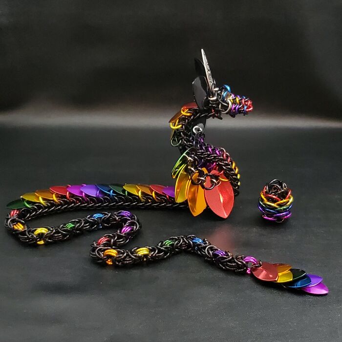 "An enchanting rainbow dark chainmaille dragon hatched on my desk today."
