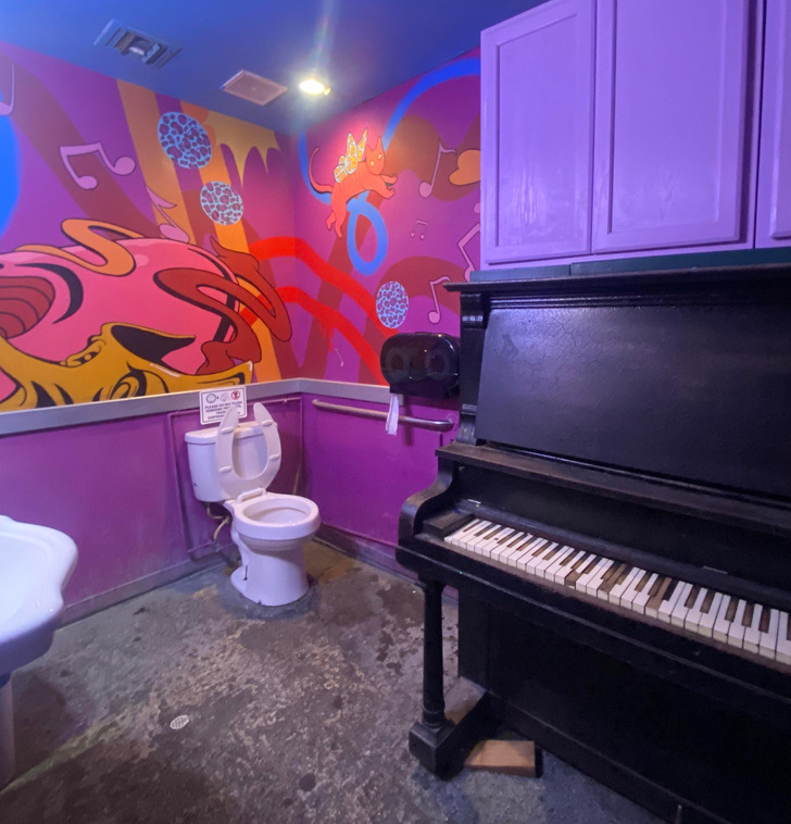 "This bar has a piano in the bathroom."