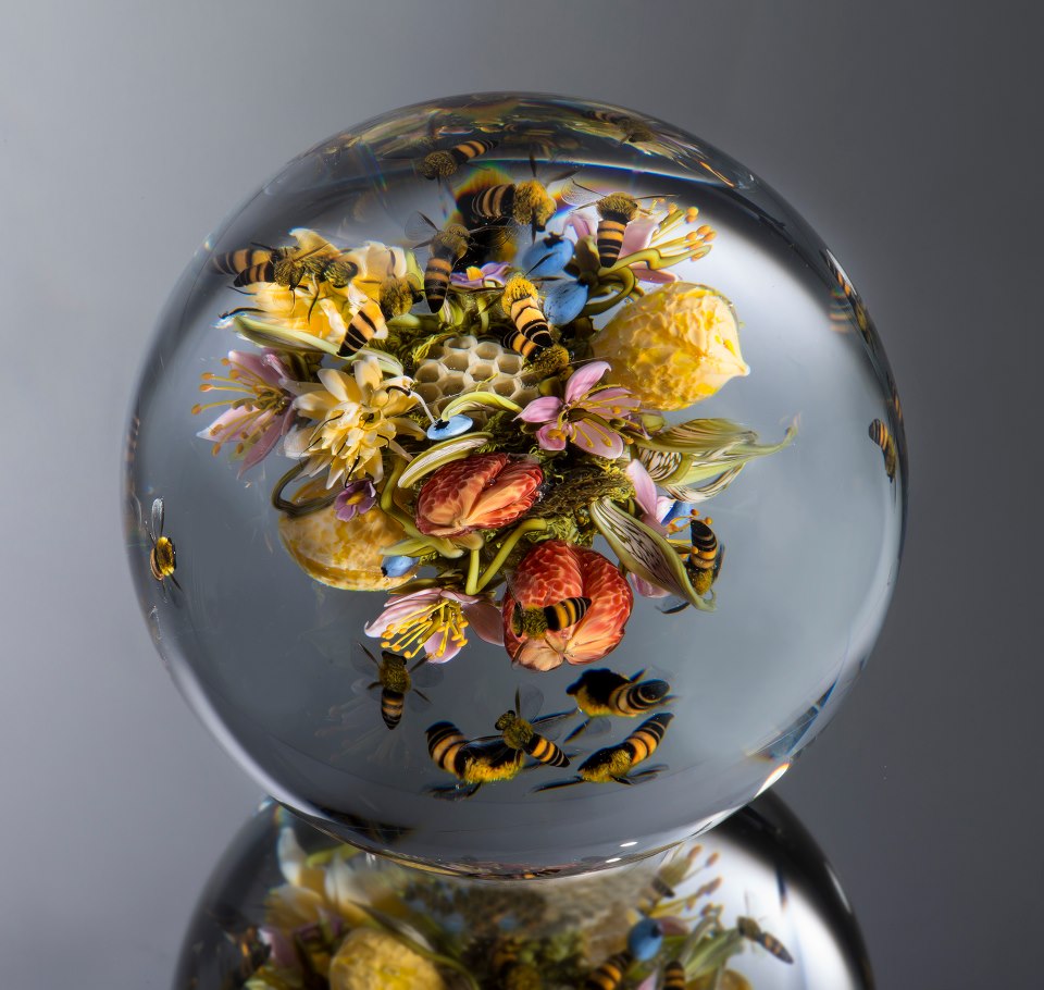 "This incredible marble has bees feeding on flowers inside it."