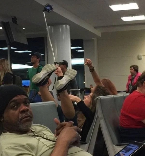 The look on this guy's face says it all.  The airport is the last place people want to deal with your nonsense.