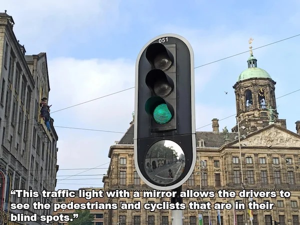 awesome designs by clever people - royal palace amsterdam - 051 E 13.8.2 "This traffic light with a mirror allows the drivers to see the pedestrians and cyclists that are in their blind spots."
