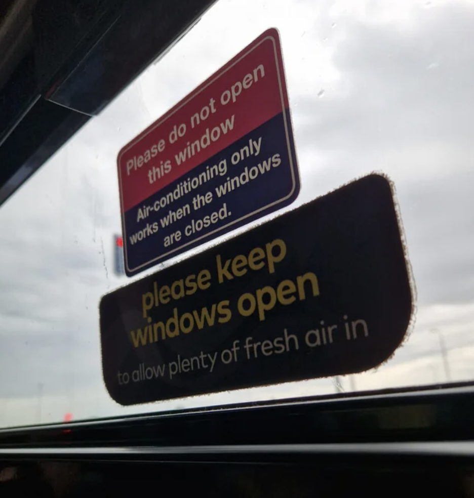 sign - Please do not open this window Airconditioning only works when the windows are closed. please keep windows open to allow plenty of fresh air in