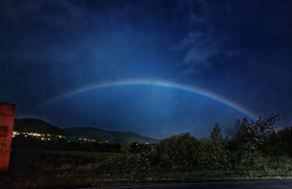 A lunar rainbow at night, produced by the moon's light.
