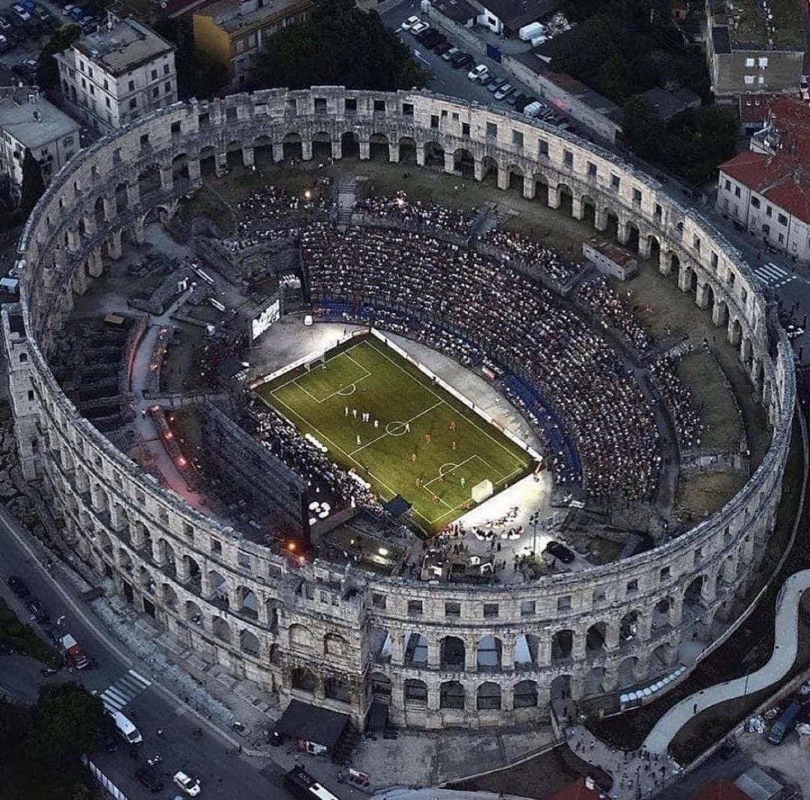 A soccer game being played in the 2,000-year-old Pula Arena amphitheater in Croatia.