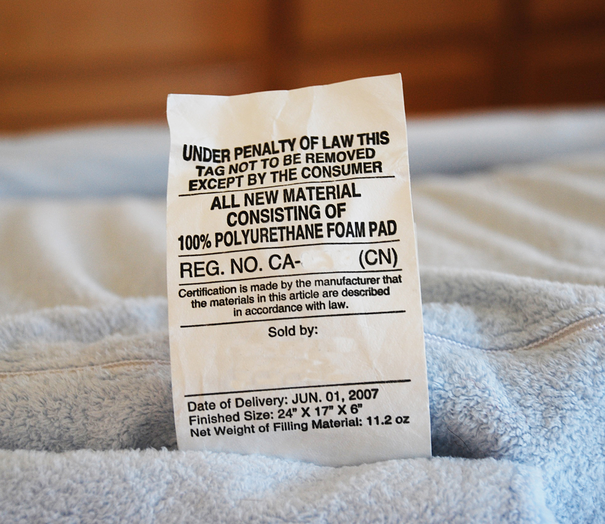 dumb laws and victimless crimes - mattress tag law - Under Penalty Of Law This Tag Not To Be Removed Except By The Consumer All New Material Consisting Of 100% Polyurethane Foam Pad Reg. No. Ca Cn Certification is made by the manufacturer that the materia