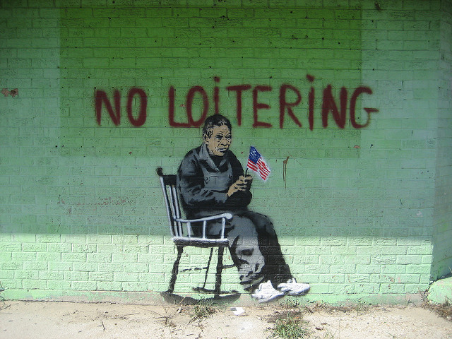 dumb laws and victimless crimes - banksy in new orleans - No Loitering Faut