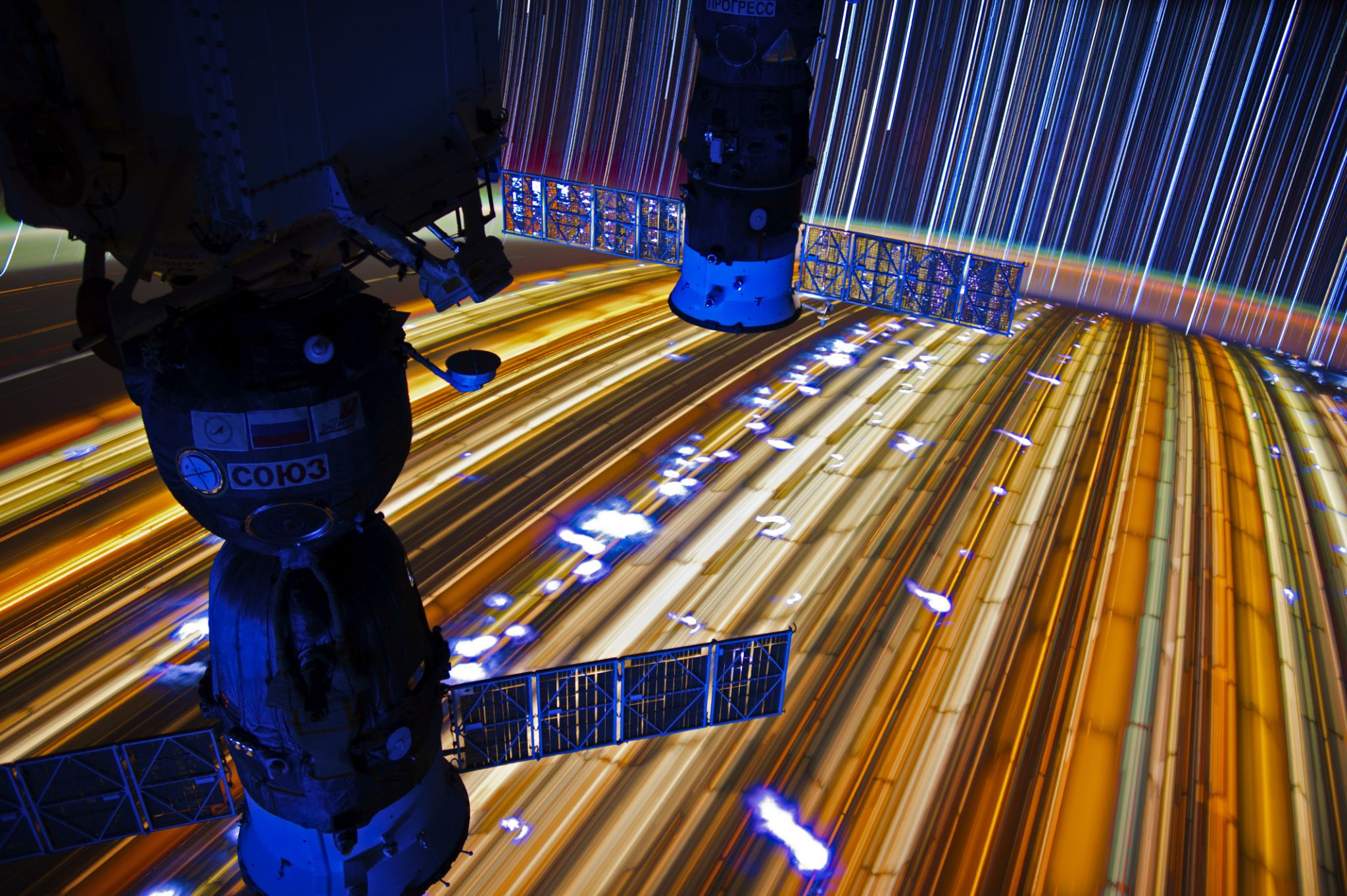 Astronaut Don Pettit shares a long exposure photo of Earth from the ISS and records himself as he repairs his watch in space (below) aboard the International Space Station. 