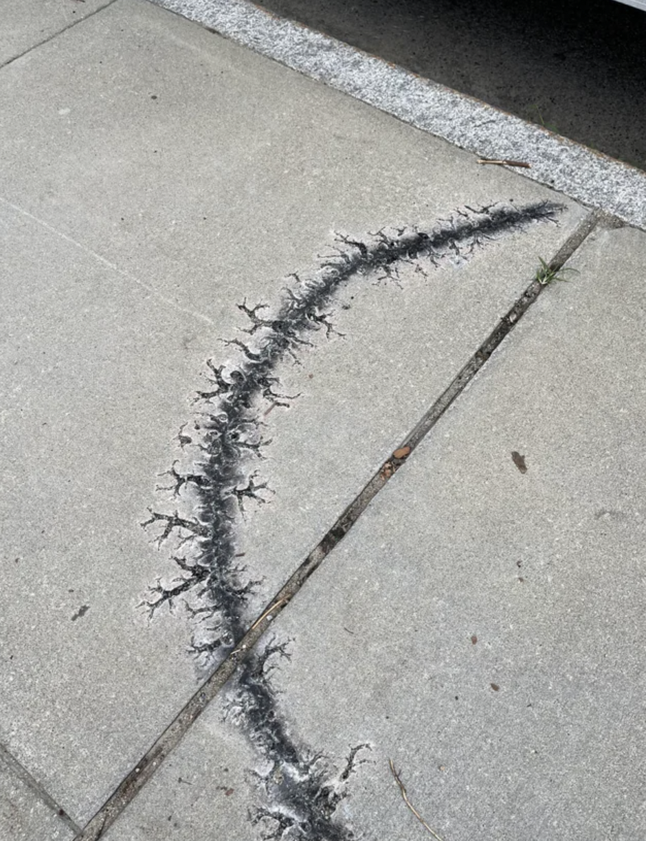 This weird burn mark on the sidewalk.