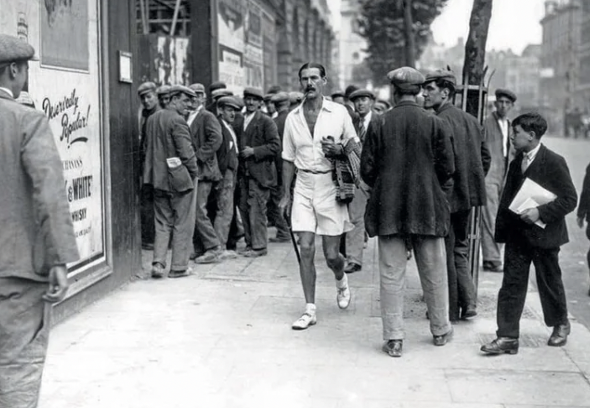An enthusiast for men's dress reform walking down the Strand in London. The MDRP, (Men’s Dress Reform Party), was formed in the interwar years in Britain, 1930.