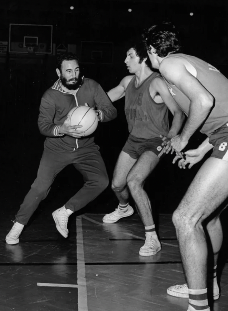Fidel Castro playing basketball against students during a visit to Krakow, Poland, 1972.