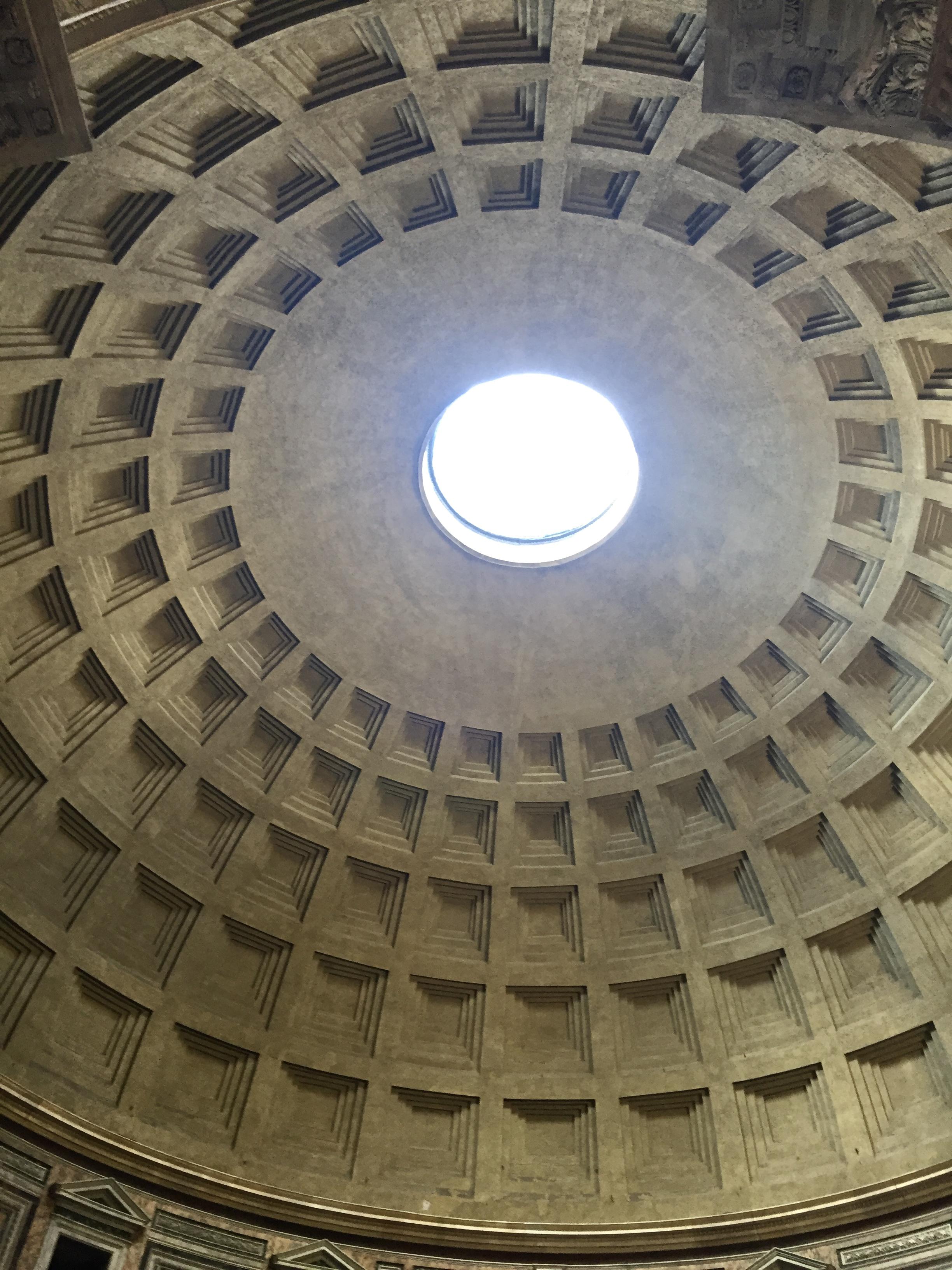 The Oculus of the Roman Pantheon is the building's source of light and ventilation. It may have also been intended to complement ceremonies, overwhelm the senses, and reduce structural pressure. 22 holes, spread across a sloped floor, still drain the rainwater. 2nd century CE. Rome, Italy.