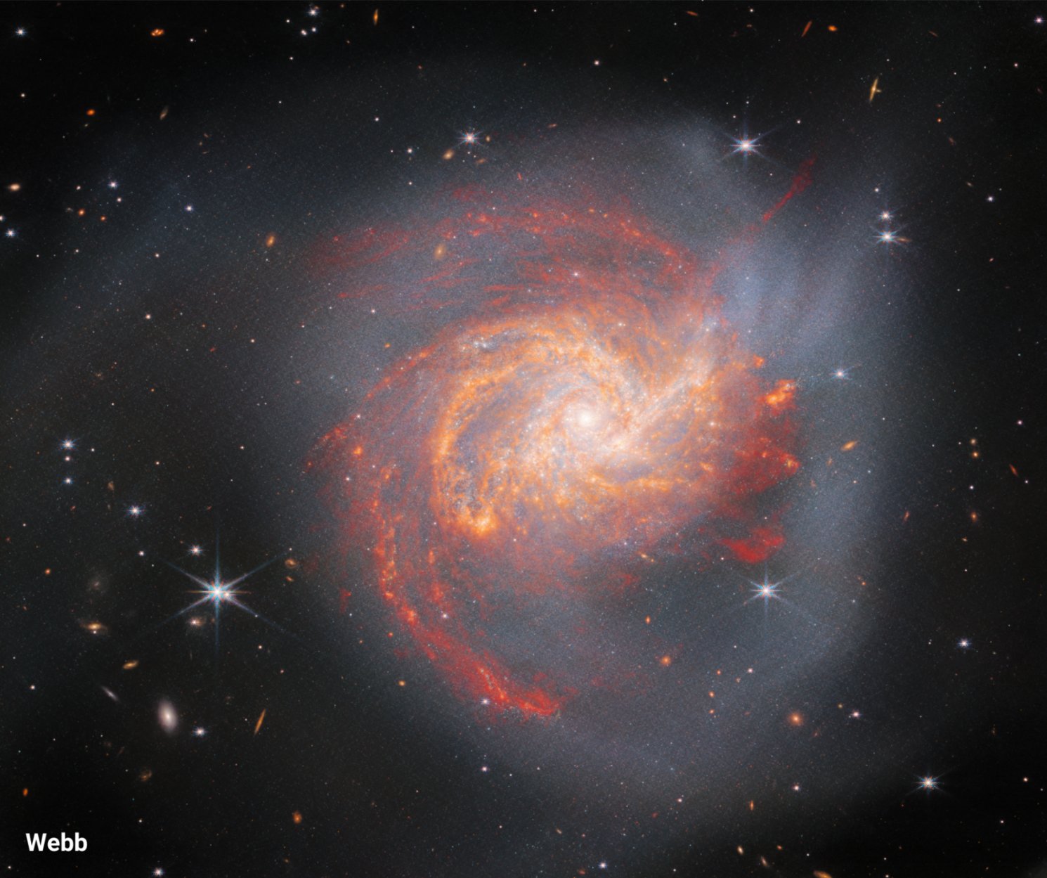 500 million years ago, 2 massive spiral galaxies collided. Their clouds of gas & dust mingled like smoke, sparking a burst of star formation. This event created galaxy NGC 3256. Its baby stars shine in infrared light, Webb’s specialty.