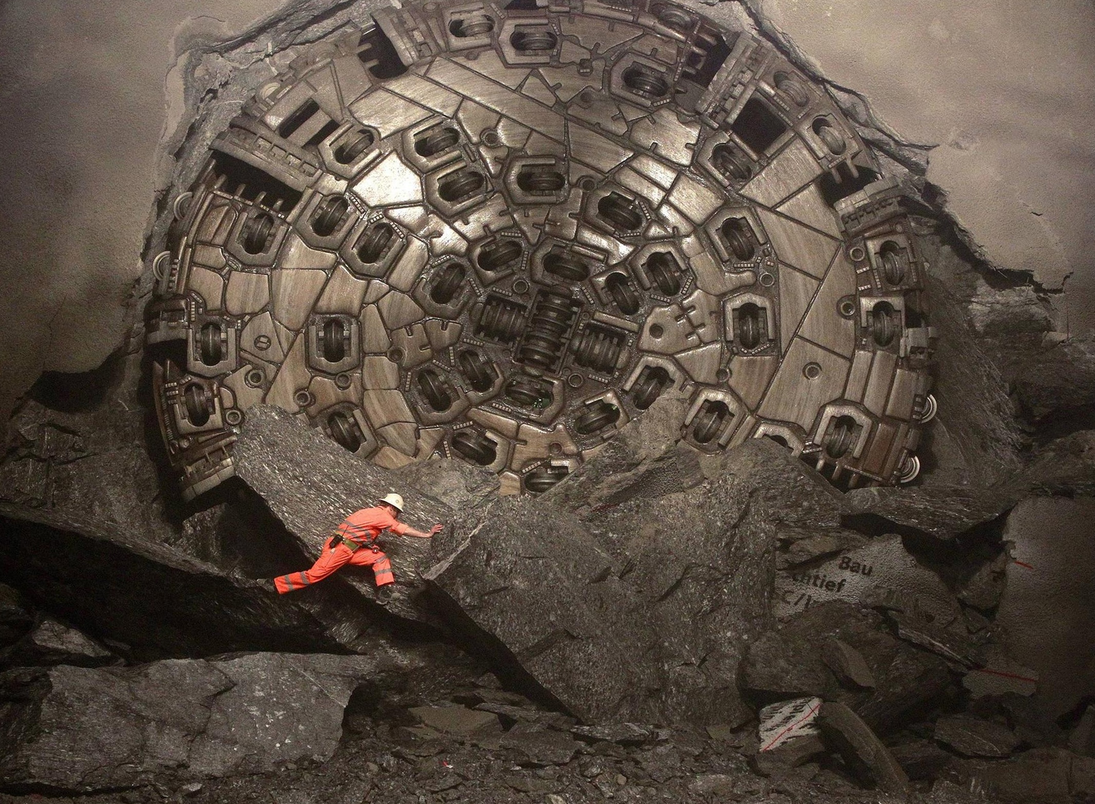 4,500 horsepower boring machine breaking through at the end of Gotthard Base Tunnel
