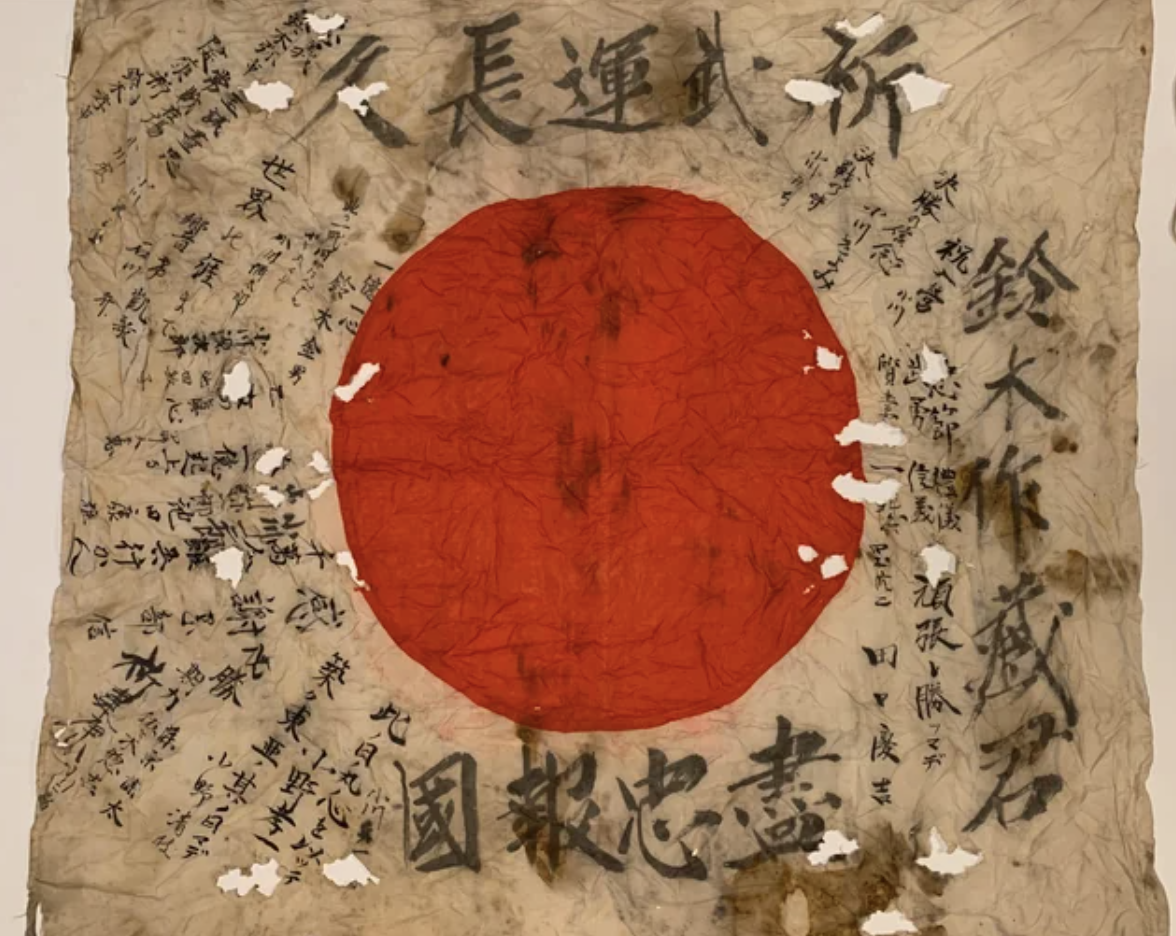 Battle damaged Japanese signed flag captured during WWII.