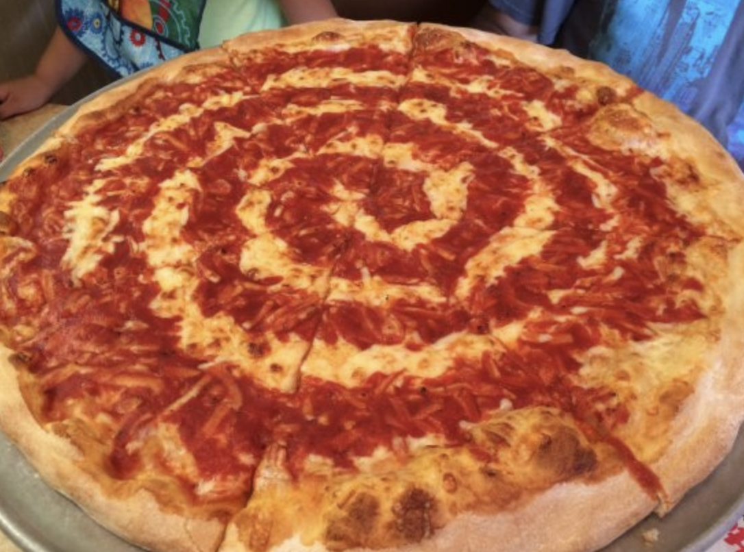 Grotto Pizza is a Delaware Maryland chain that puts its sauce in a spiral pattern. Maybe just spread it around like everybody else?