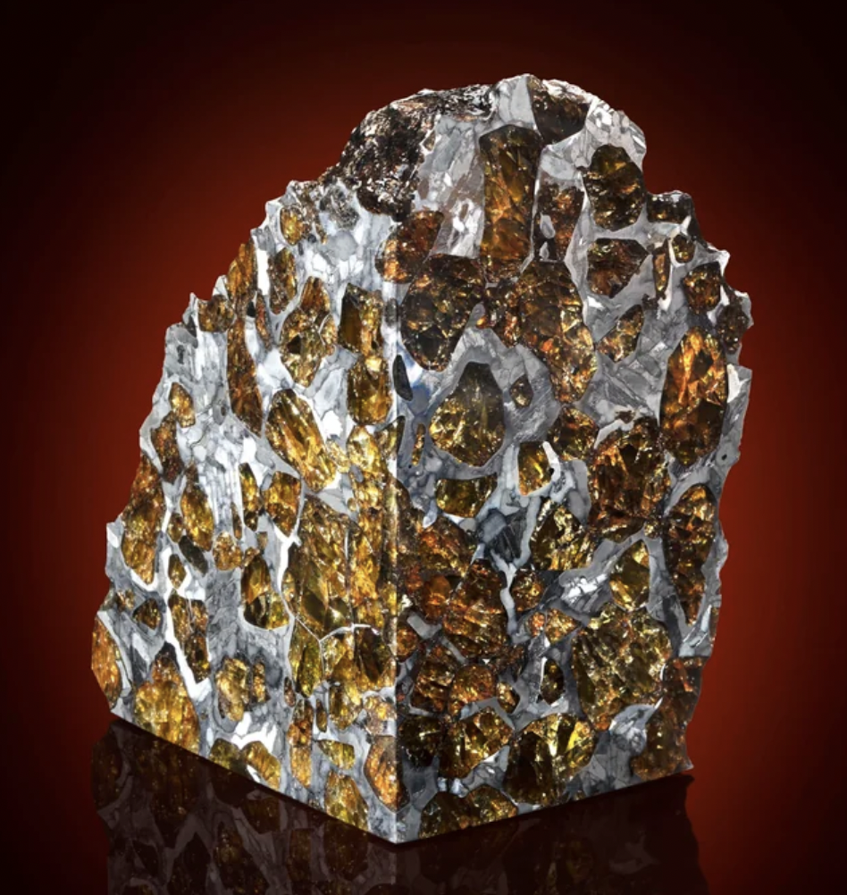 Polished piece of a rare Fukang Pallasite meteorite, found in the Gobi Desert.