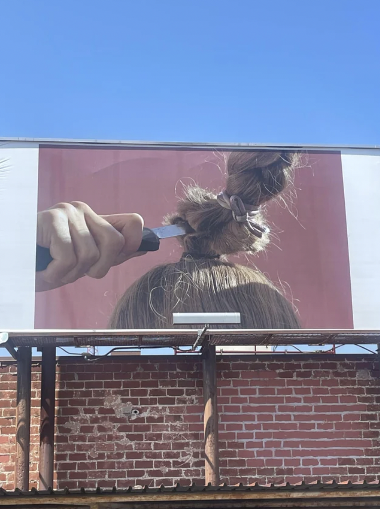 I saw this odd/weird billboard advertisement downtown and no one knows the meaning.