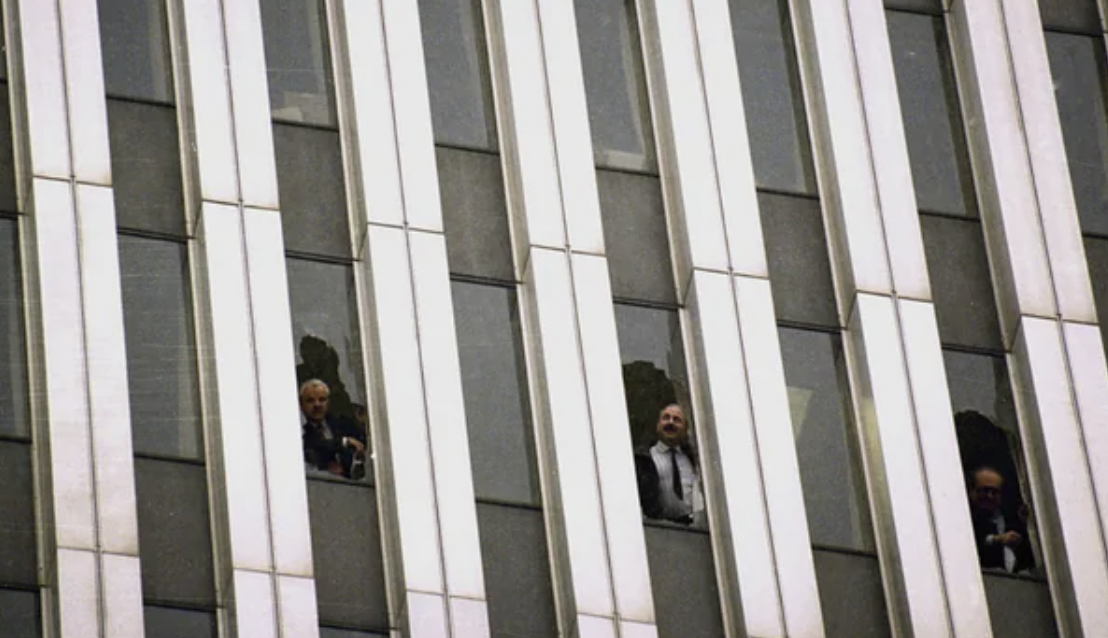 People look out of the Twin Towers after the 1993 bombing.