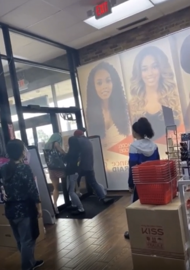 Trashy woman caught stealing in hair store.