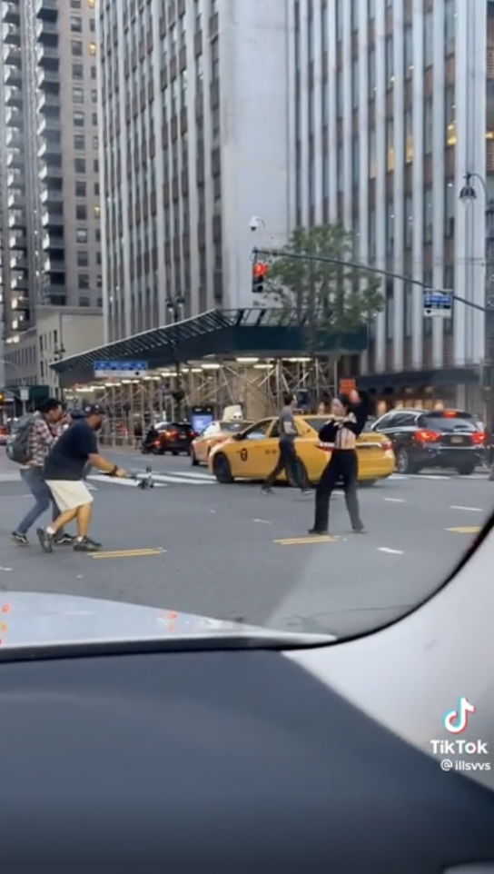 Tourists in NYC hold up traffic to film a sunset. Meanwhile an influencer does the same for a TikTok dance.