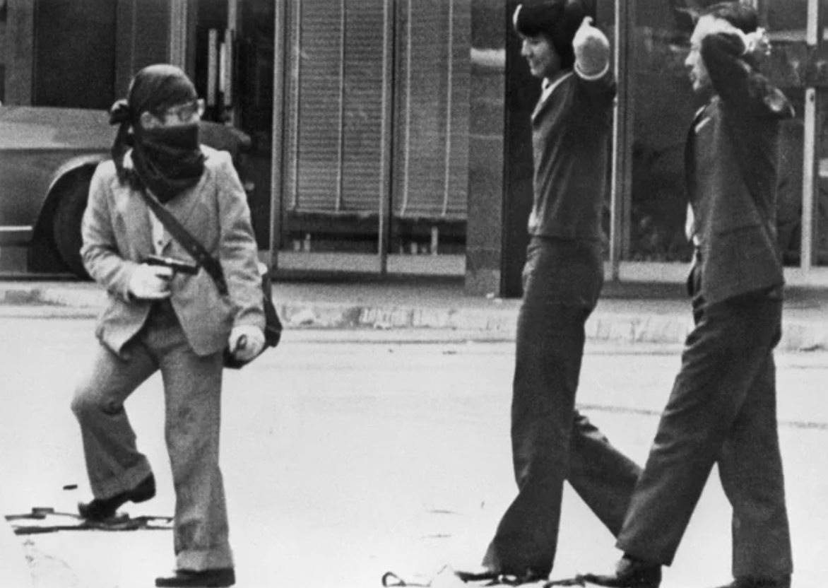 A Japanese Red Army member with a gun and two hostages in Kuala Lumpur, August 7, 1975.