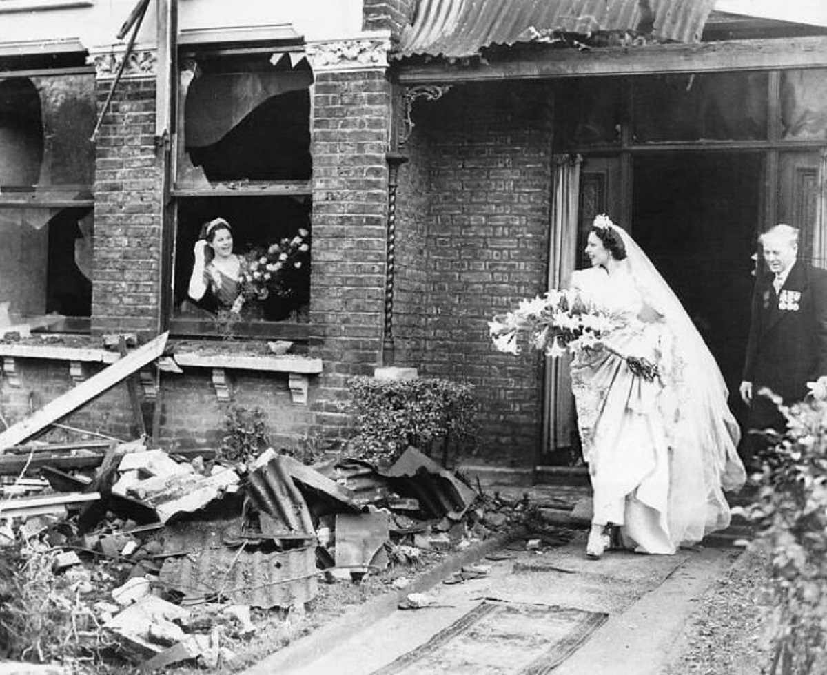 Bride leaving her recently bombed home to get married, 1940.