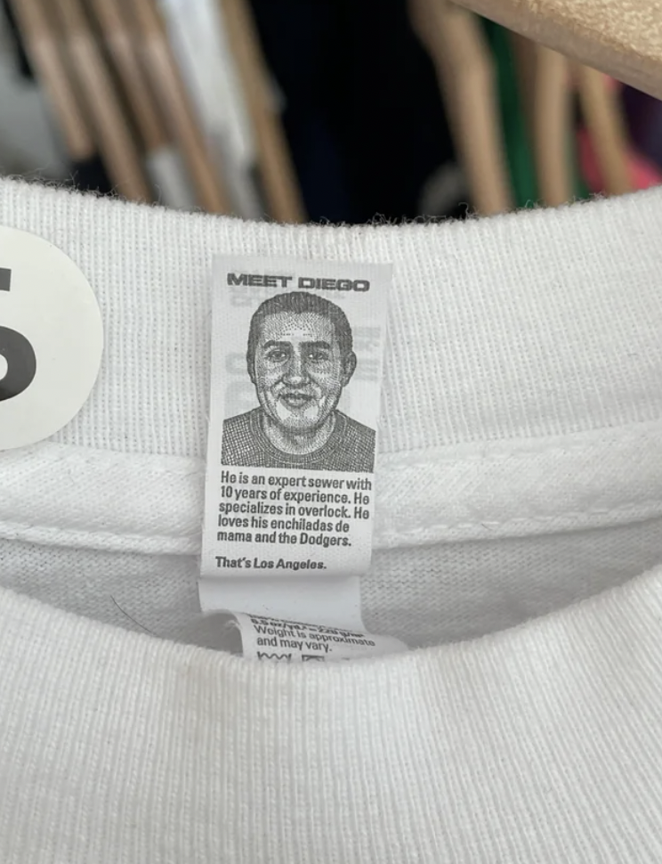 T-shirt company puts a picture of the person who made it on the tag.