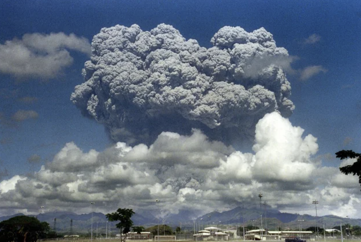 A giant volcanic mushroom cloud explodes some 20 kilometers high from Mount Pinatubo, June 12, 1991.