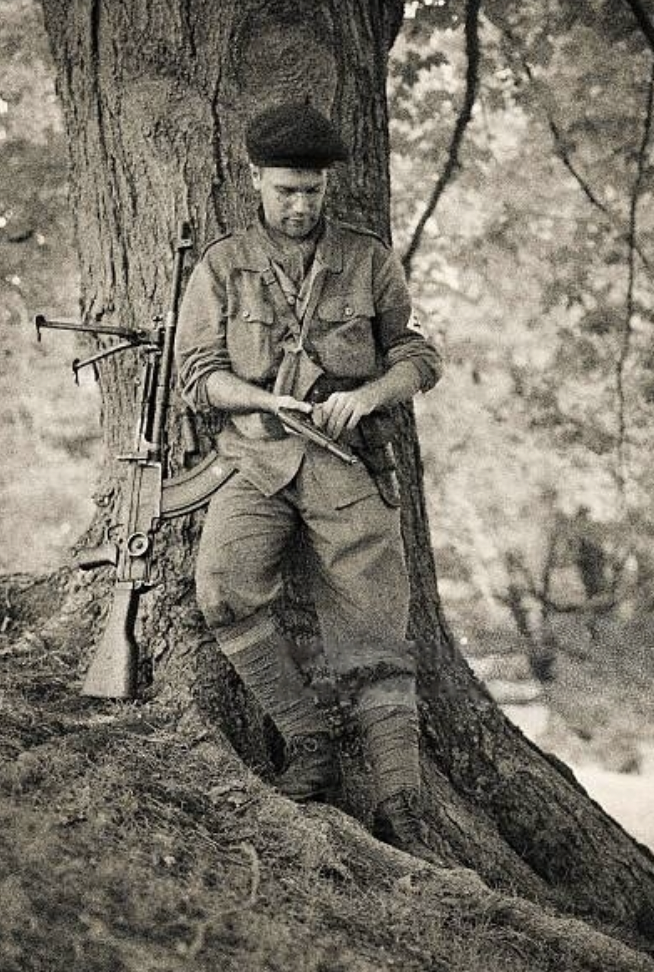 French partisan checking his personal weapon, occupied France 1942 - 43.