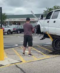 20 Clowns Driving Lifted Trucks Who Can't See Where They're Going