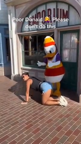 Twerking in front of Donald Duck. 