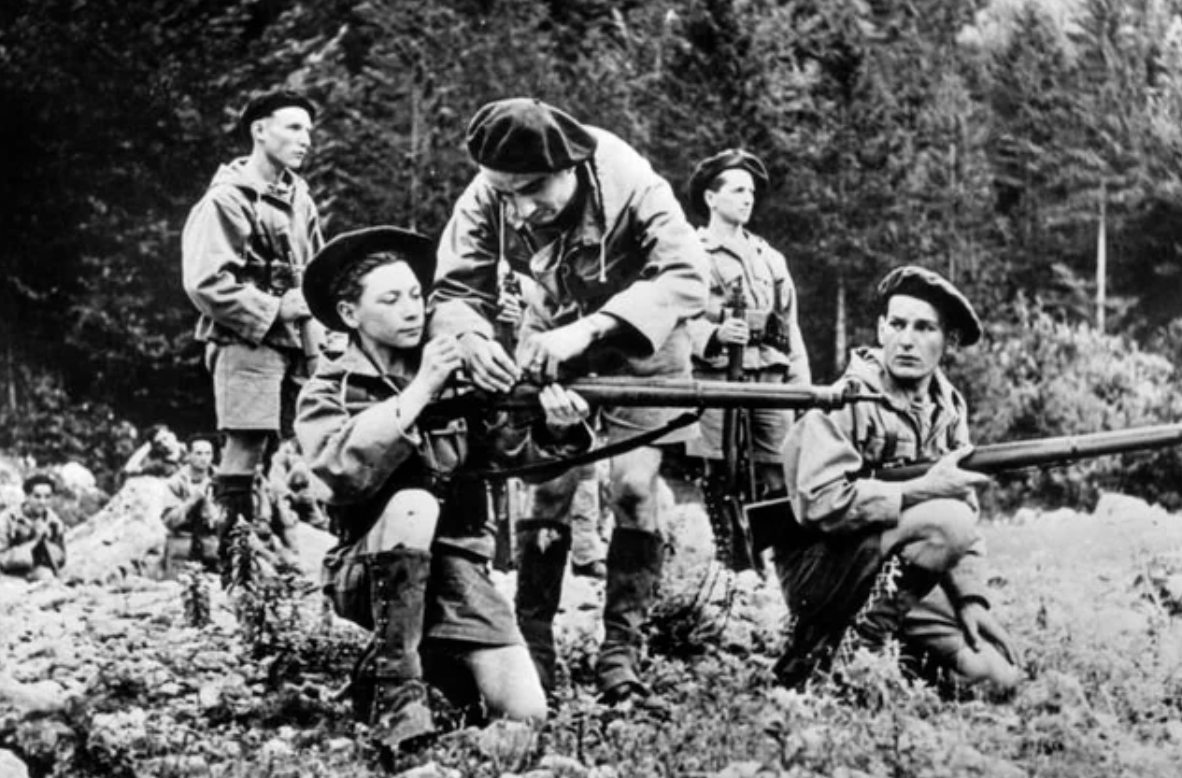 A young scout is taught how to handle a British made rifle, Vercors 1944.